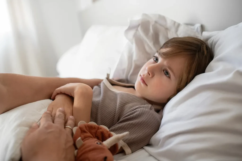 Diarrhea in children can be common. Here is an image of a child suffering from diarrhea, illustrating common diarrhea causes in children, pediatric diarrhea symptoms, prevention tips for kids, and typical triggers.