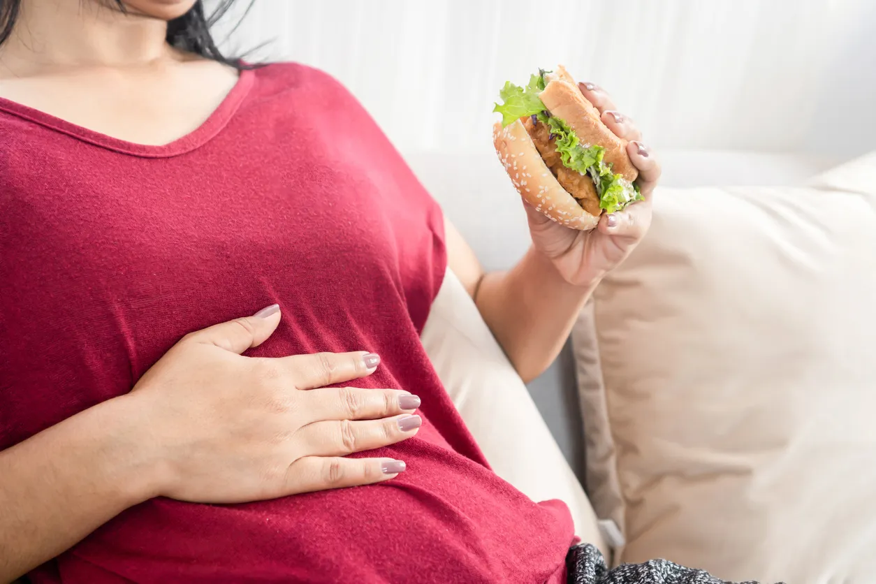 Image of a woman experiencing diarrhea after eating, illustrating symptoms like diarrhea after eating, post-meal diarrhea causes, food-related diarrhea, and digestive issues after eating.